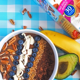 A healthy, delicious way to enjoy chocolate pudding for breakfast! Banana and avocado make this smoothie bowl creamy and secretly nutritious.
