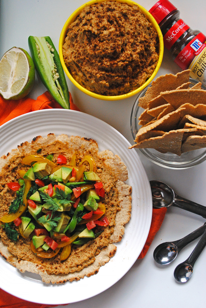 oat tortilla with chipotle hummus on white plate