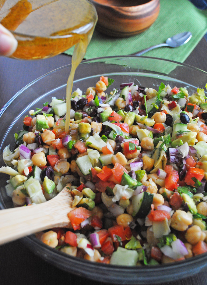 Packed with veggies and fresh Greek flavors, this chickpea salad with tangy vegan almond feta makes a quick, nutritious dinner perfect for lunch leftovers!