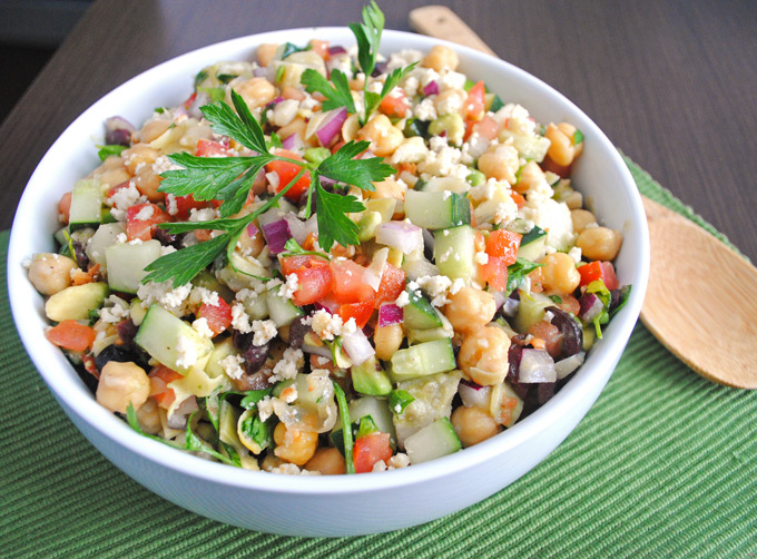 Packed with veggies and fresh Greek flavors, this chickpea salad with tangy vegan almond feta makes a quick, nutritious dinner perfect for lunch leftovers!