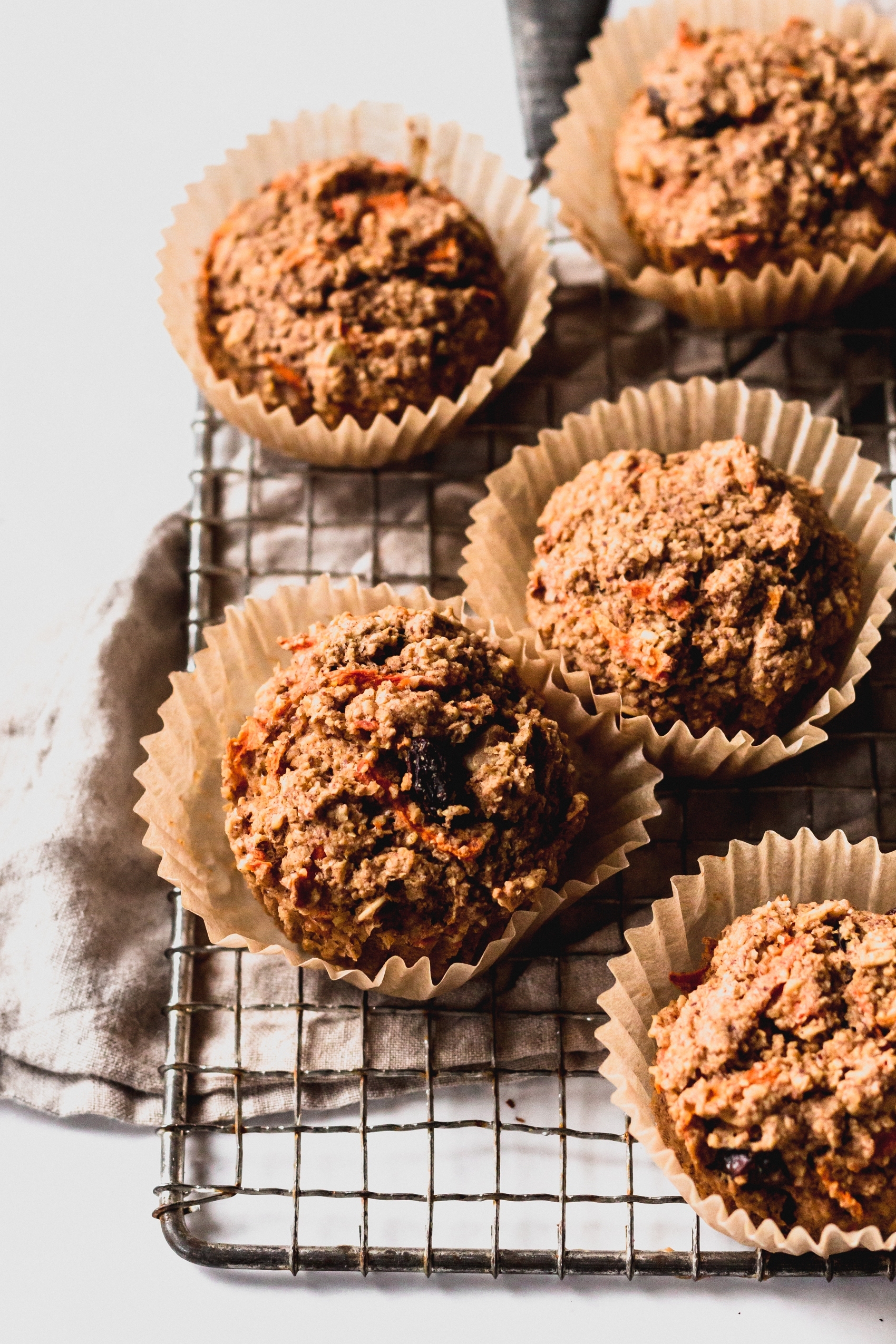 a close up of a batch of carrot muffins