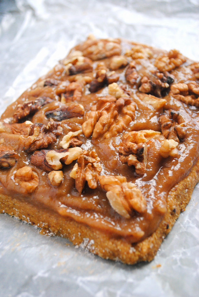 a layer of homemade vegan pumpkin nougat topped with a layer of date caramel and walnuts