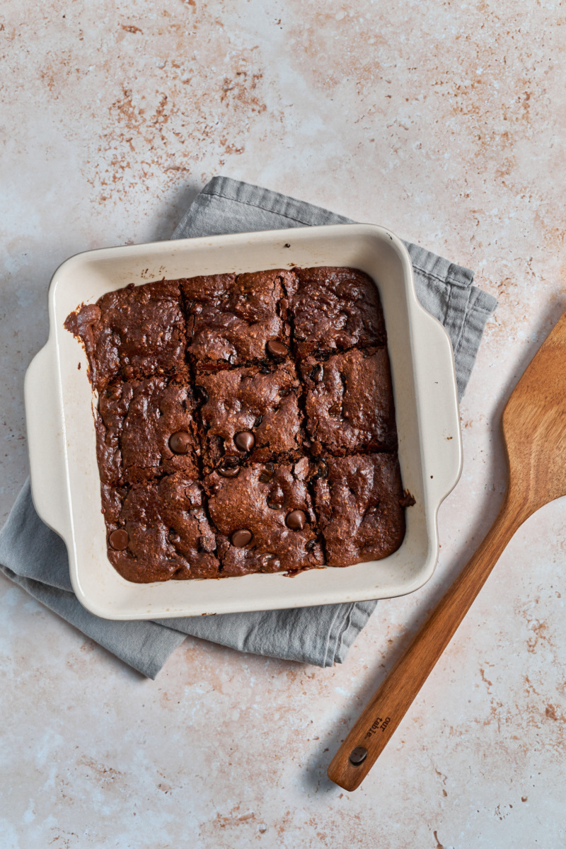 a dish of almond butter chocolate chip blondies cut into squares