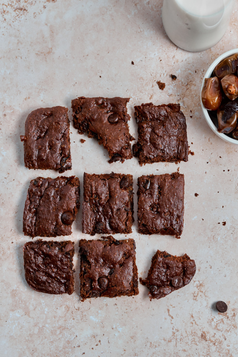 nine almond butter chocolate chip blondies arranged in a square