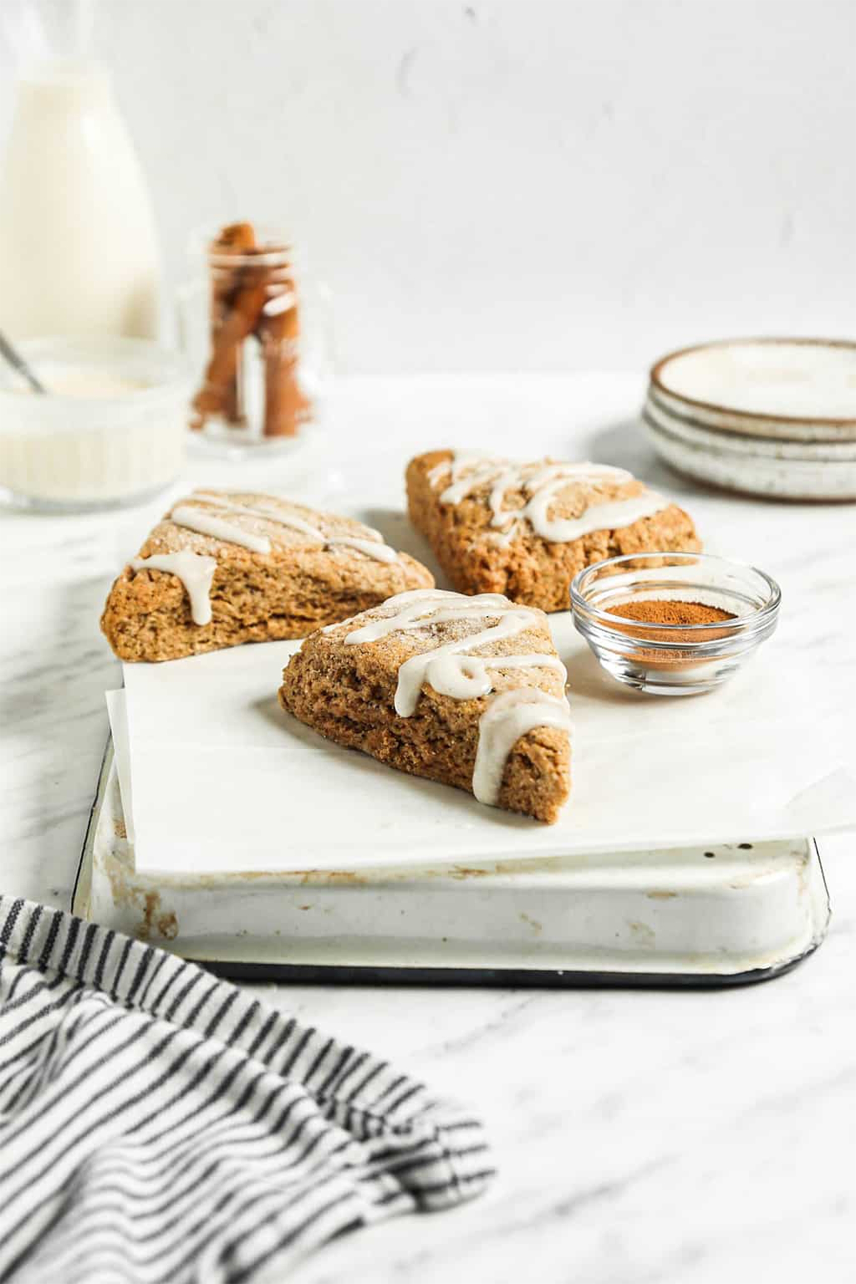 four vegan scones topped with vanilla icing