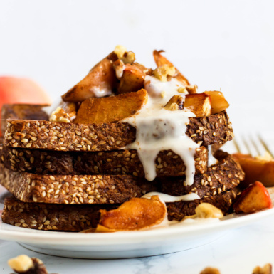 a stack of french toast topped with apple pie filling