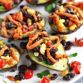 Looking for a healthy party appetizer? This Mexican Stuffed Avocado with Buffalo Tahini Sauce recipe is the perfect one to cook for any gathering.