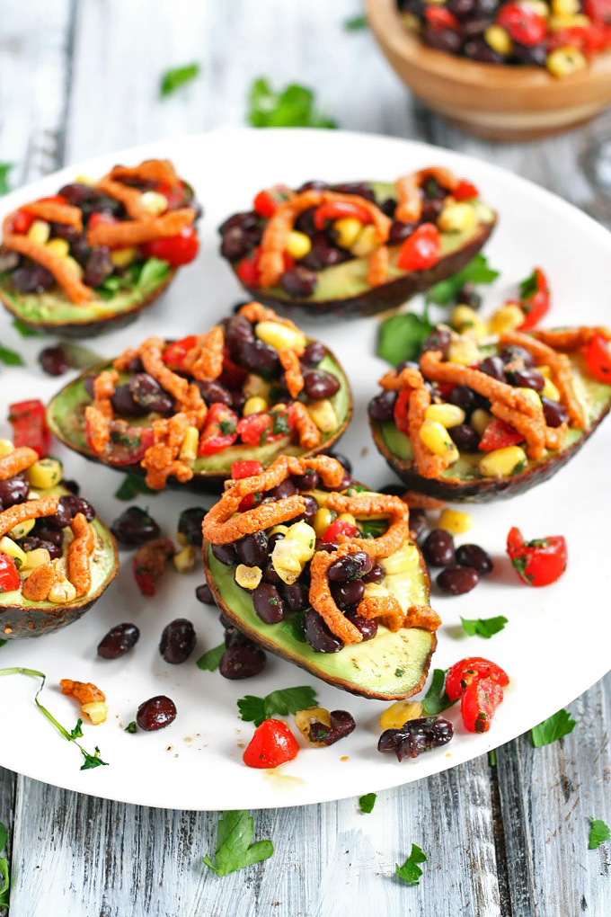 Looking for a healthy party appetizer? This Mexican Stuffed Avocado with Buffalo Tahini Sauce recipe is the perfect one to cook for any gathering.