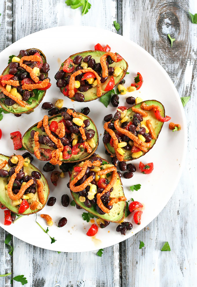 Looking for a healthy party appetizer? This Mexican Stuffed Avocado with Buffalo Tahini Sauce recipe is the perfect one to cook for any gathering.