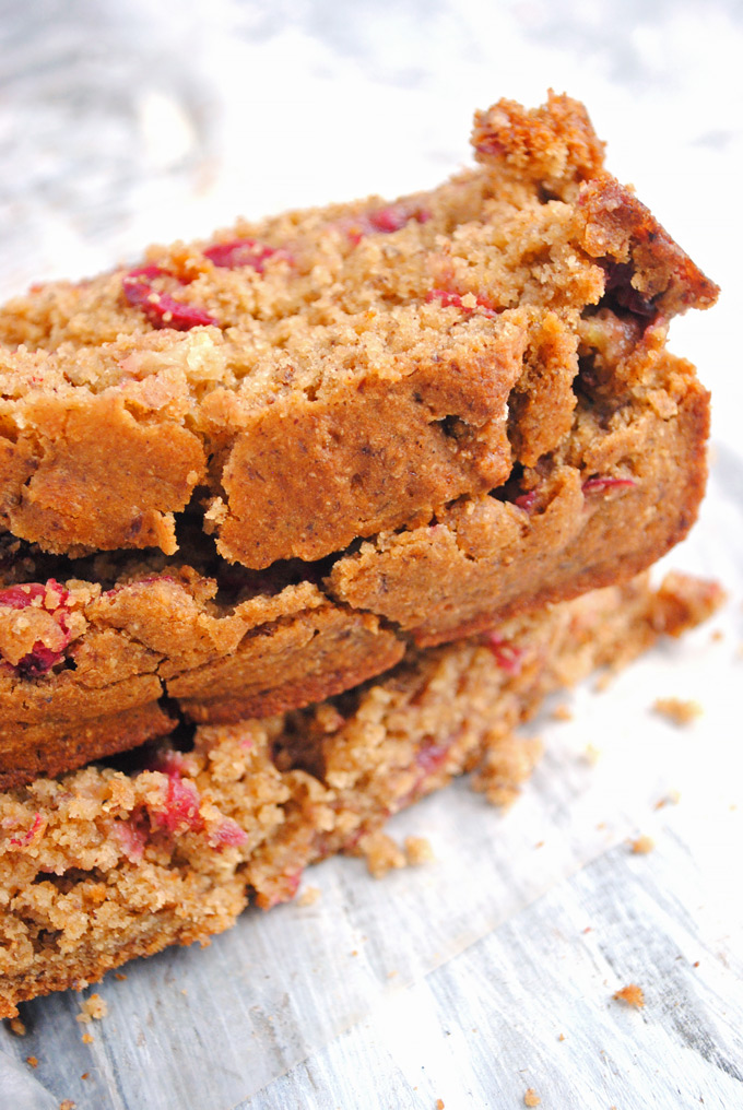 three slices of cranberry orange bread stacked on top of each other