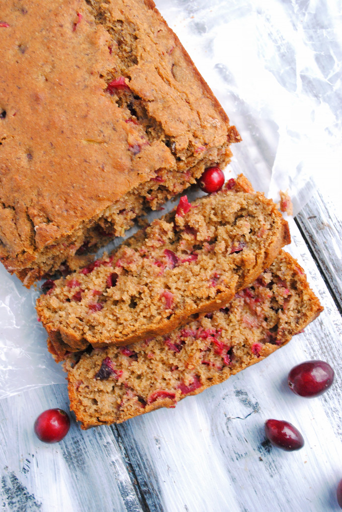 a loaf of cranberry orange bread that has been cut into slices