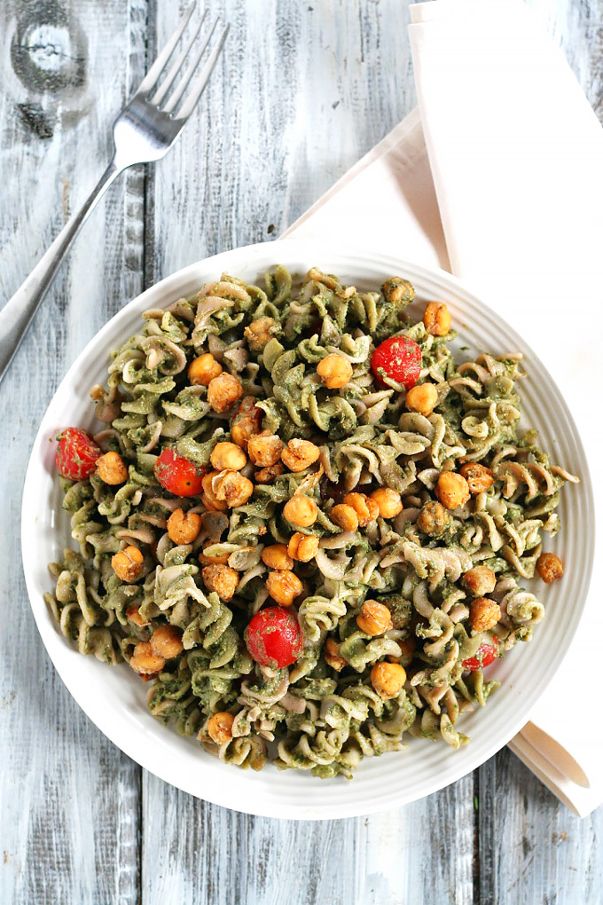 Looking for a dinner that's done in under one hour? This Avocado Pesto Pasta is creamy and satisfying, and the roasted chickpeas take it to the next level.