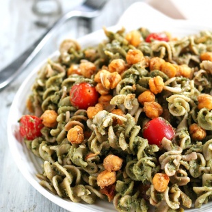 Looking for a dinner that's done in under one hour? This Avocado Pesto Pasta is creamy and satisfying, and the roasted chickpeas take it to the next level.
