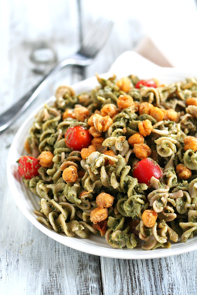 Looking for a dinner that's done in under one hour? This Avocado Pesto Pasta is creamy and satisfying, and the roasted chickpeas take it to the next level.