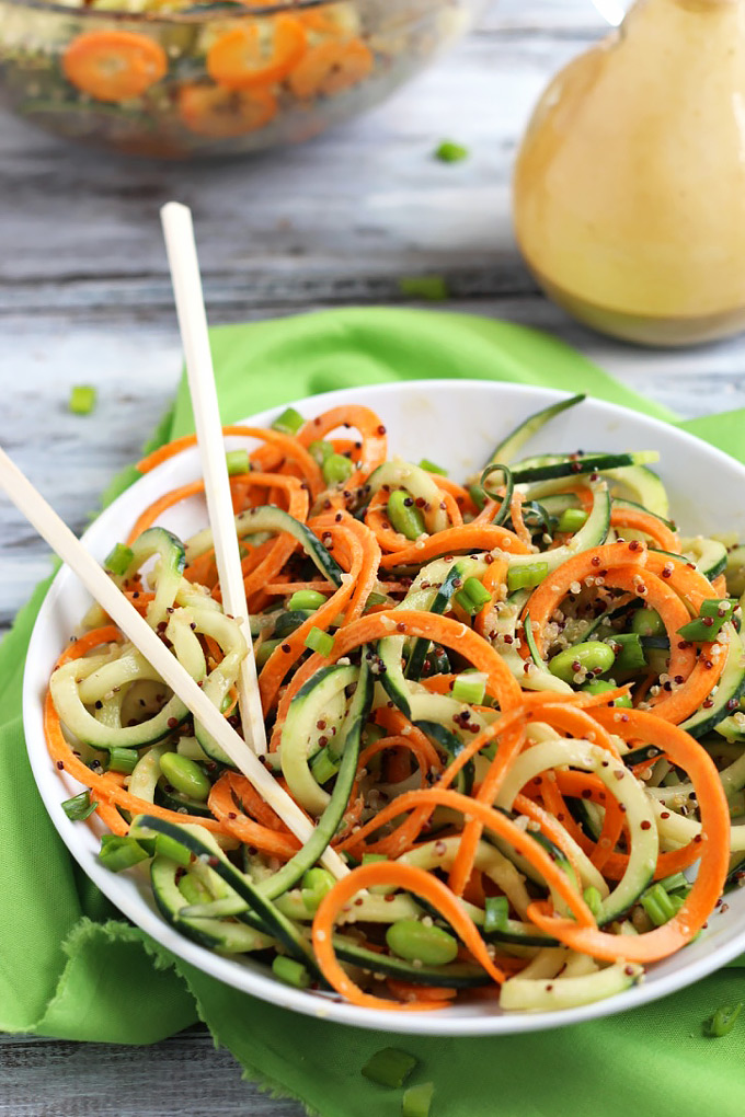 Step up your salad game with this healthy Asian Quinoa Salad featuring cucumber and carrot noodles! The creamy peanut dressing is the perfect complement.