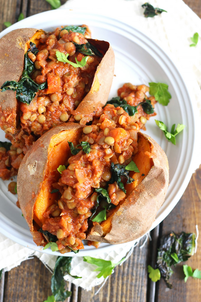 two sweet potatoes topped with a bbq lentil filling