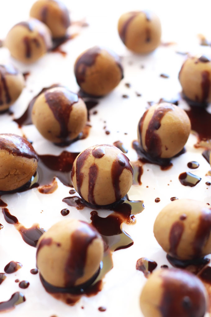 These Chocolate Covered Chickpea Protein Balls taste just like cookie dough, but also pack a ton of protein! They're perfect for a sweet snack on-the-go.