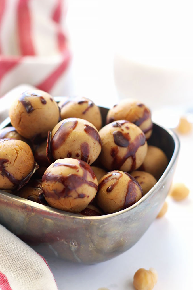 These Chocolate Covered Chickpea Protein Balls taste just like cookie dough, but also pack a ton of protein! They're perfect for a sweet snack on-the-go.