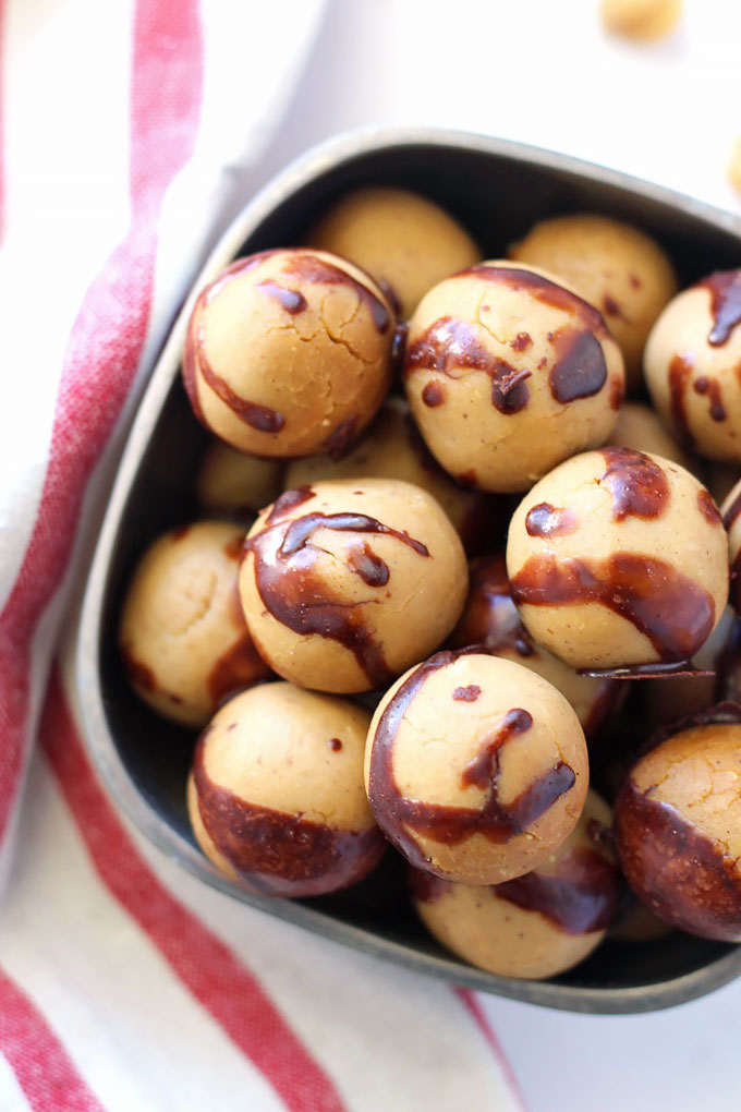 These Chocolate Covered Chickpea Protein Balls taste just like cookie dough, but also pack a ton of protein! They're perfect for a sweet snack on-the-go.