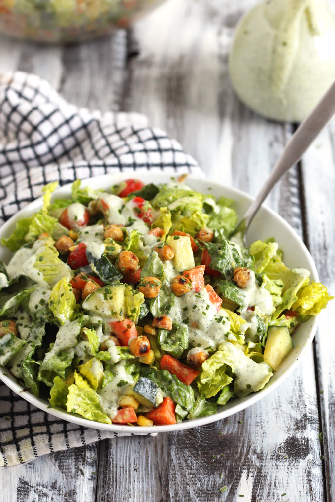 This Roasted Chickpea Salad is packed with nutritious vegetables and protein, perfect for an on-the-go lunch. The vegan ranch dressing is so flavorful!