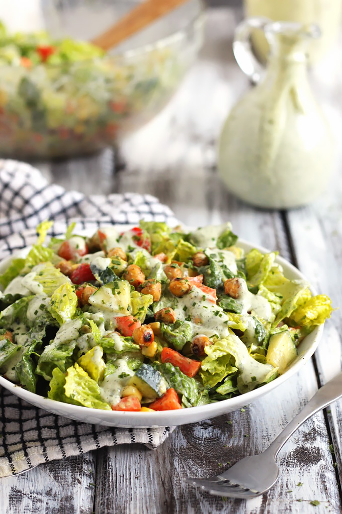 This Roasted Chickpea Salad is packed with nutritious vegetables and protein, perfect for an on-the-go lunch. The vegan ranch dressing is so flavorful!