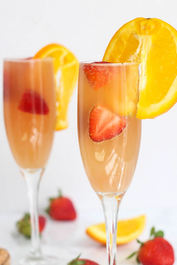 Enjoy this gut-friendly sparkling drink at your next party or brunch! A Strawberry Kombucha Mimosa is a great way to keep happy hour healthy.