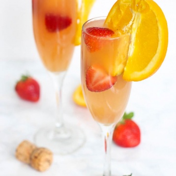 Enjoy this gut-friendly sparkling drink at your next party or brunch! A Strawberry Kombucha Mimosa is a great way to keep happy hour healthy.