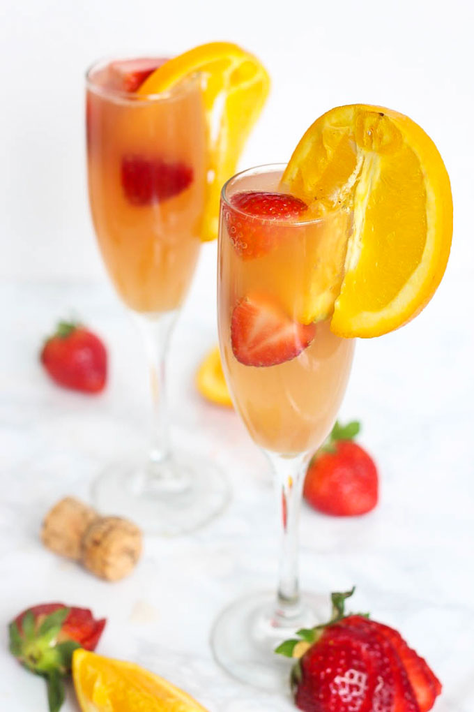 Enjoy this gut-friendly sparkling drink at your next party or brunch! A Strawberry Kombucha Mimosa is a great way to keep happy hour healthy.