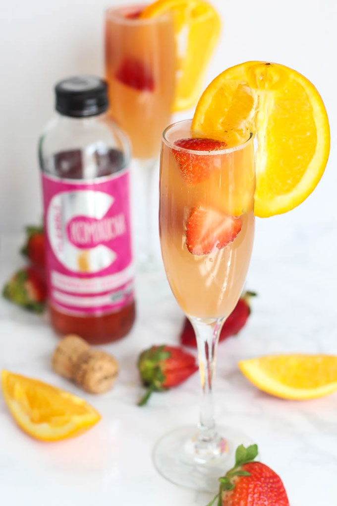 Enjoy this gut-friendly sparkling drink at your next party or brunch! A Strawberry Kombucha Mimosa is a great way to keep happy hour healthy.