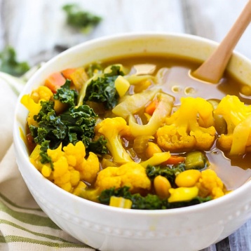 a bowl of golden turmeric veggie soup