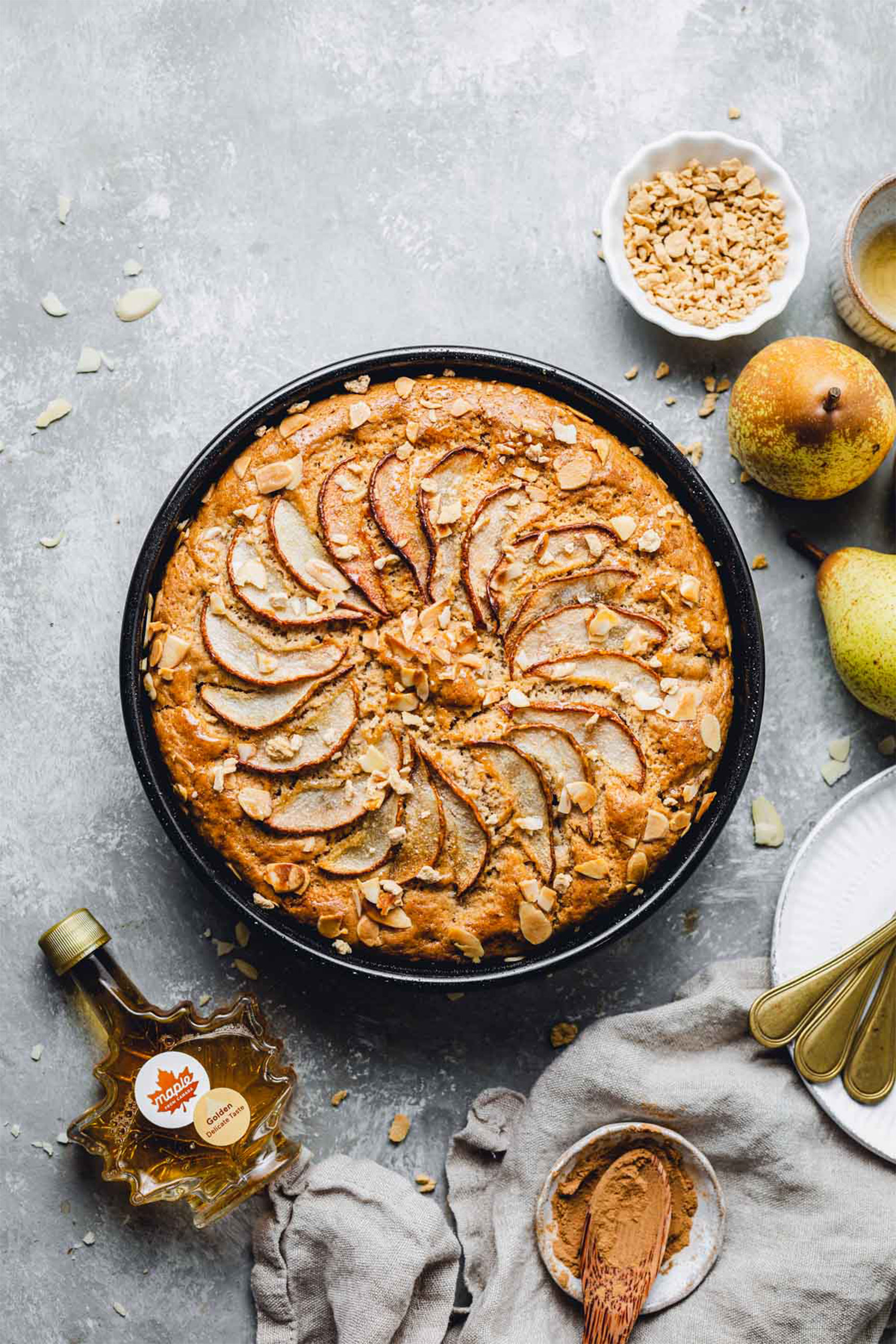 a vegan spice cake topped with pear slices