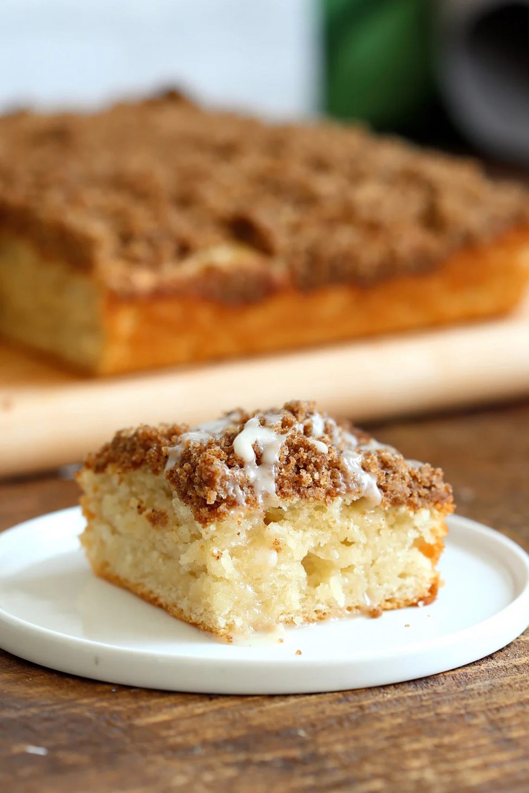 a slice of vegan coffee cake topped with cinnamon streusel