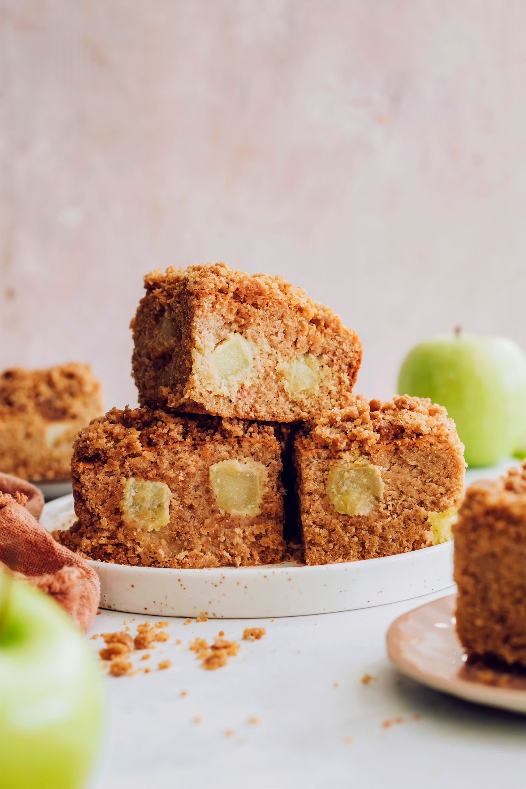 a plate with three slices of apple coffee cake