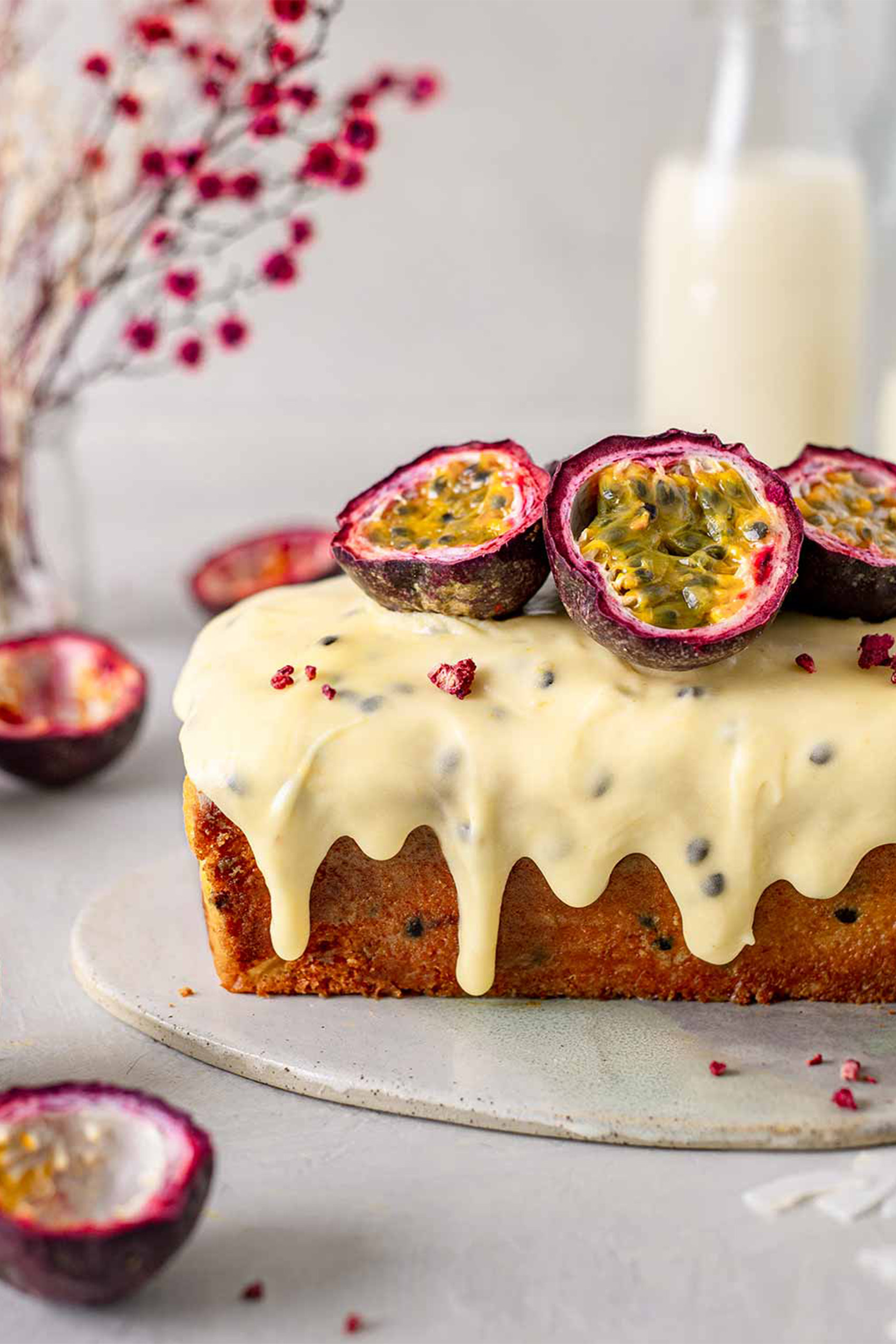 a vegan passionfruit cake topped with vanilla glaze
