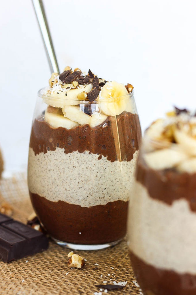 a cup of chia pudding topped with sliced banana