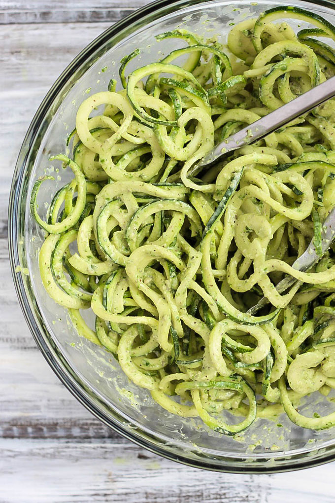 These Vegan Parmesan Cauliflower Steaks over Hemp Pesto Zoodles feel gourmet but are done in 1 hour! This gluten-free dinner is perfect to impress anyone.