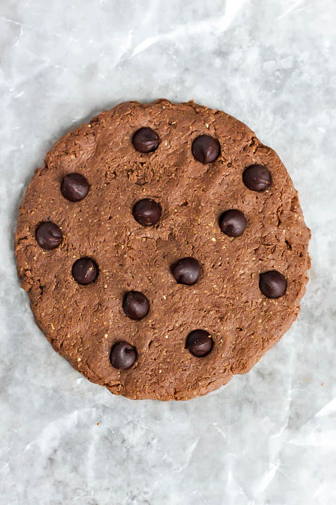 A HUGE chocolate protein cookie that will satisfy your sweet cravings! Healthy enough to have for breakfast, vegan & gluten-free. Plus, it's super tasty!