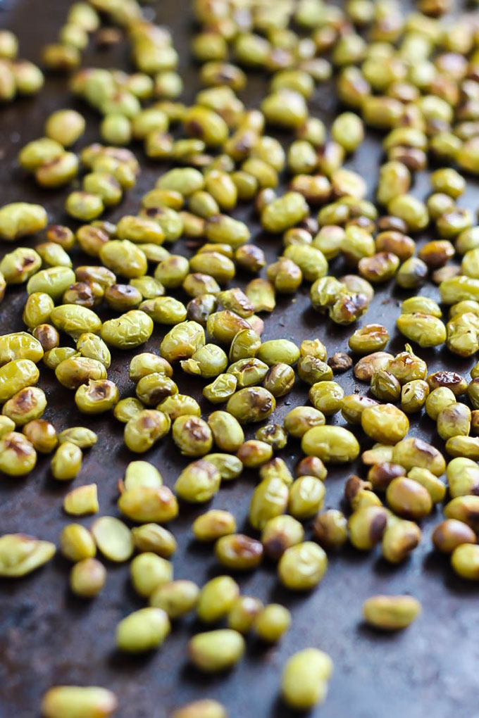 Ditch the chips and reach for a handful of these Salt and Vinegar Roasted Edamame! They're crispy, flavorful, and make a great vegan protein-packed snack.