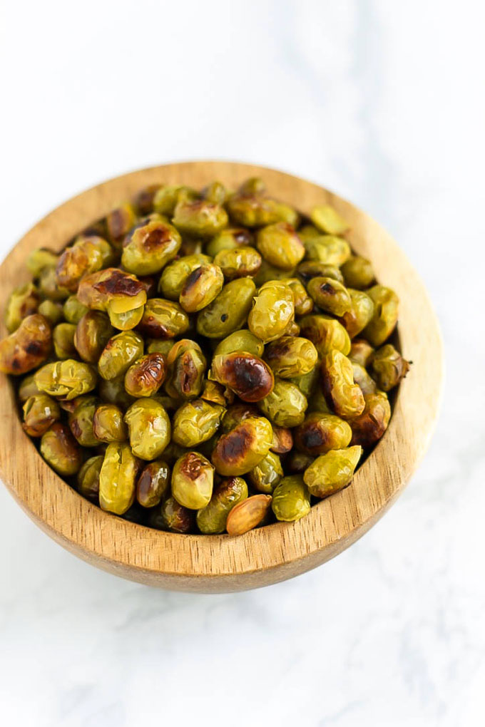 Ditch the chips and reach for a handful of these Salt and Vinegar Roasted Edamame! They're crispy, flavorful, and make a great vegan protein-packed snack.