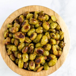 Ditch the chips and reach for a handful of these Salt and Vinegar Roasted Edamame! They're crispy, flavorful, and make a great vegan protein-packed snack.