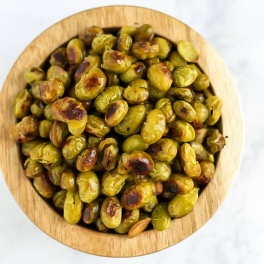 Ditch the chips and reach for a handful of these Salt and Vinegar Roasted Edamame! They're crispy, flavorful, and make a great vegan protein-packed snack.