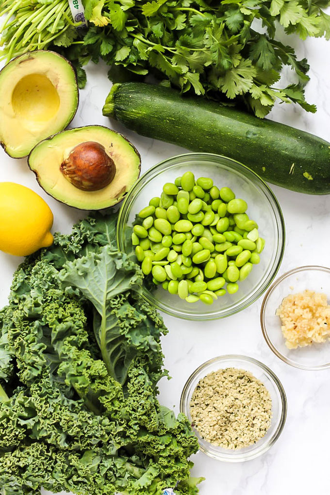 Feed your body all the healthy green things with this vegan Green Goddess Avocado Kale Salad with edamame & zucchini! You'll be glowing from the inside out.