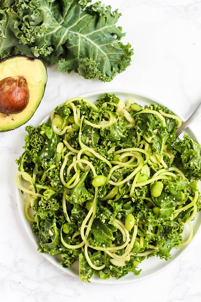 Feed your body all the healthy green things with this vegan Green Goddess Avocado Kale Salad with edamame & zucchini! You'll be glowing from the inside out.