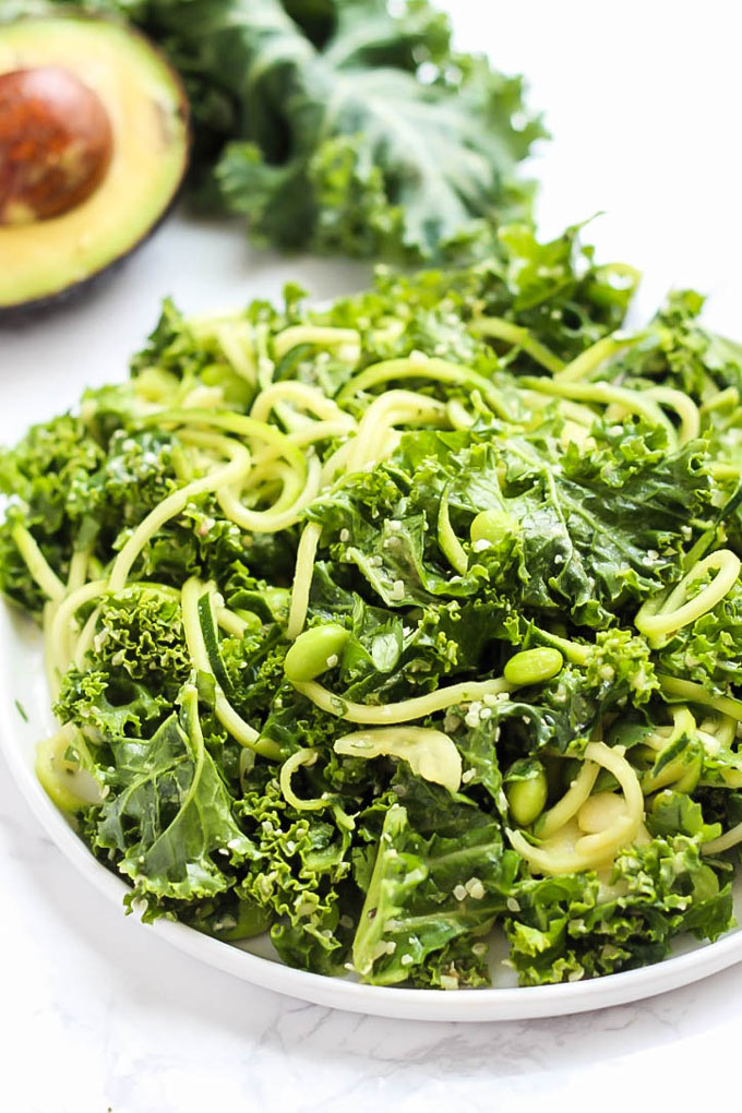 Feed your body all the healthy green things with this vegan Green Goddess Avocado Kale Salad with edamame & zucchini! You'll be glowing from the inside out.