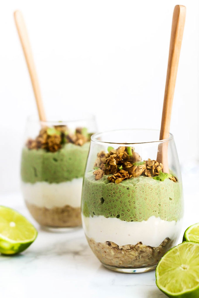 two vegan chia pudding parfaits made with key lime chia pudding, vanilla vegan pudding and a no-bake crust