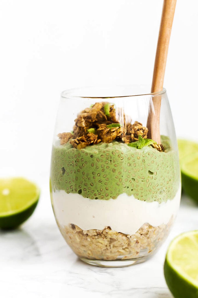 a vegan chia pudding parfait featuring an oat crust, vanilla vegan pudding and a top layer of lime chia pudding