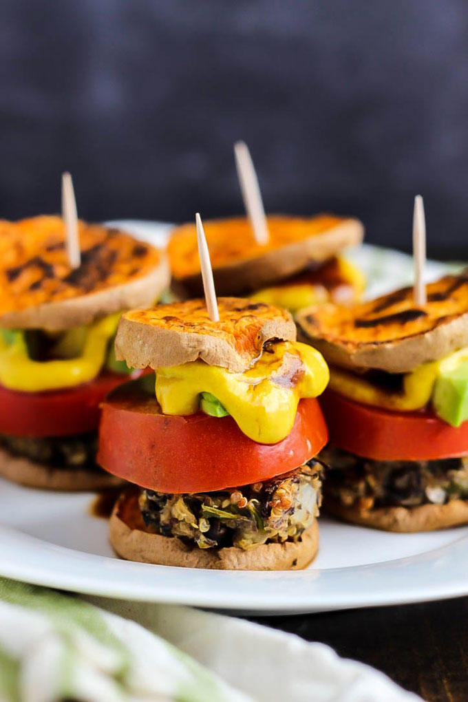 Hearty veggie burgers on sweet potato buns make these Vegan Sweet Potato Sliders a great party appetizer! Have fun with the toppings. Healthy & gluten-free!