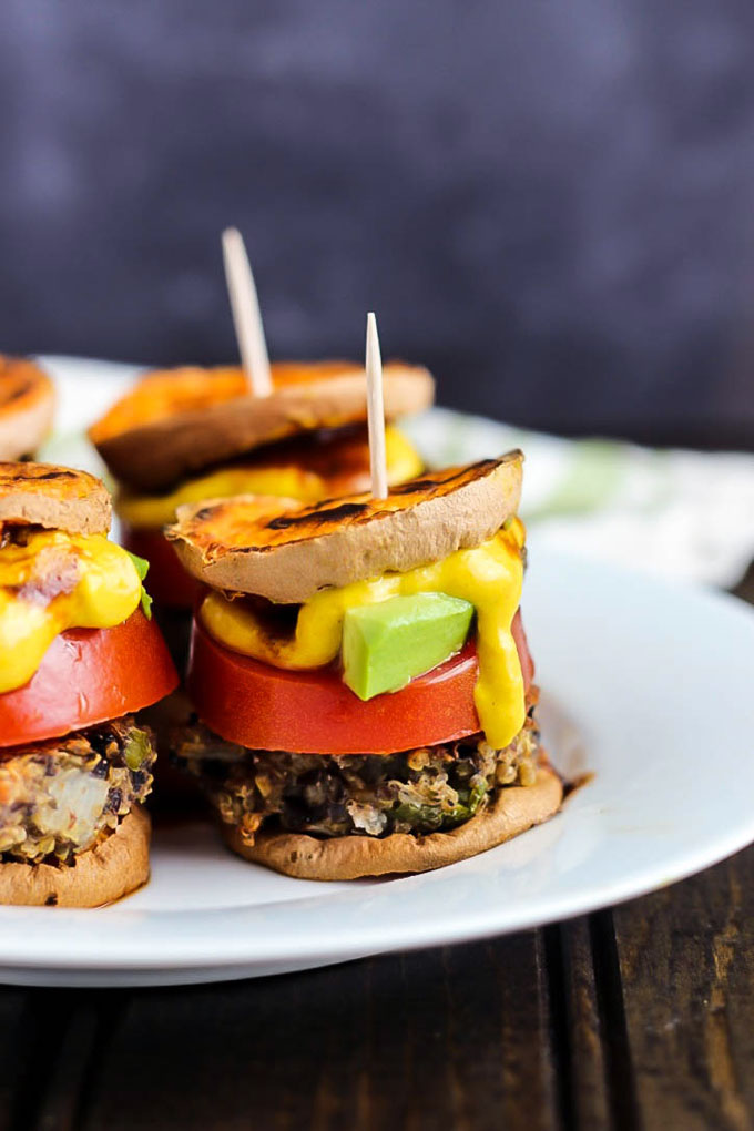 Hearty veggie burgers on sweet potato buns make these Vegan Sweet Potato Sliders a great party appetizer! Have fun with the toppings. Healthy & gluten-free!