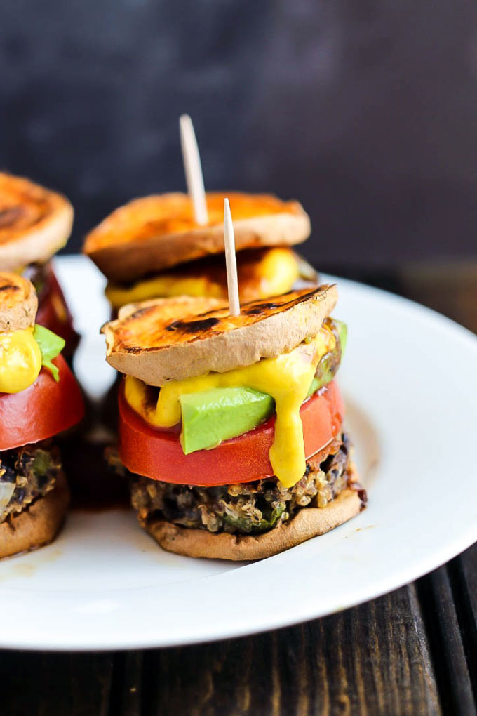 Hearty veggie burgers on sweet potato buns make these Vegan Sweet Potato Sliders a great party appetizer! Have fun with the toppings. Healthy & gluten-free!