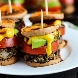 Hearty veggie burgers on sweet potato buns make these Vegan Sweet Potato Sliders a great party appetizer! Have fun with the toppings. Healthy & gluten-free!